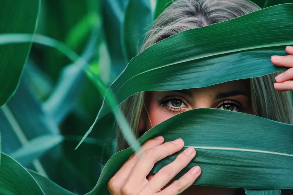 Woman hiding in the green